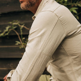 fit model wearing The Chore Shirt in Natural Herringbone, sleeve detail