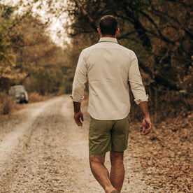 fit model wearing The Chore Shirt in Natural Herringbone, back shot