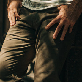 fit model wearing The Democratic All Day Pant in Olive Bedford Cord, cropped up close