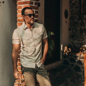 fit model wearing The Short Sleeve Western in Natural, hand in pocket