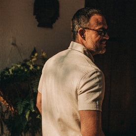 fit model wearing The Short Sleeve Western in Natural, back shot