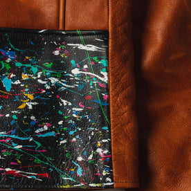 material shot of the whiskey—cosmos contrast details on The Moto Jacket in Whiskey & Cosmos