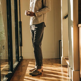 our fit model wearing The Camp Pant in Charcoal Corduroy—inside looking left