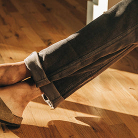 our fit model wearing The Camp Pant in Charcoal Corduroy—cropped shot of pant cuff
