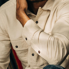 our fit model wearing The Corso in Natural Double Cloth—cropped shot of elbow