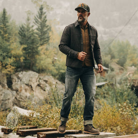 fit model wearing The Decker Jacket in Wool Beach Cloth, standing on bridge