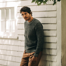 our fit model wearing The Headland Sweater in Marled Navy—cropped shot looking at camera