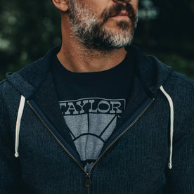 our fit model wearing The Heavy Bag Tee in Retro Block Print—cropped shot chest up