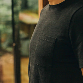 our fit model wearing The Heavy Bag Tee in Black—cropped shot of chest