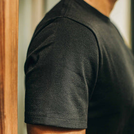 our fit model wearing The Heavy Bag Tee in Black—cropped shot of shoulder