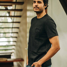 our fit model wearing The Heavy Bag Tee in Black—cropped shot, waist up