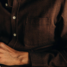 our fit model relaxing in The Jack in Brushed Rust Oxford—cropped shot of chest