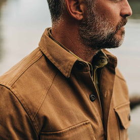 our fit model wearing The Shop Shirt in British Khaki Boss Duck—cropped shot looking right
