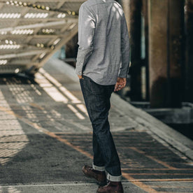 our fit model wearing The Slim Everyday Jean—cropped shot of model walking ahead