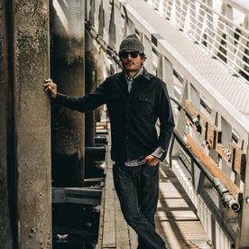 our fit model wearing The Yosemite Shirt in Black—on a dock