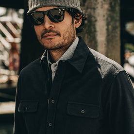 our fit model wearing The Yosemite Shirt in Black—cropped shot with sunglasses on