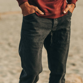 fit model wearing The Chore Pant in Coal Boss Duck, hands in pockets