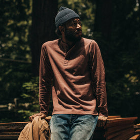 fit model wearing The Heavy Bag Henley in Burgundy, looking right
