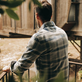 fit model wearing The Ledge Shirt in Navy Plaid, back shot