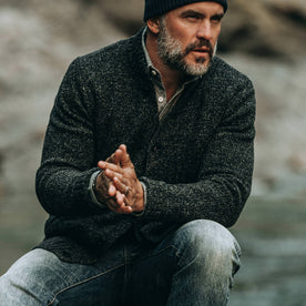 fit model wearing The Bomber Sweater in Black Sesame, hands clasped