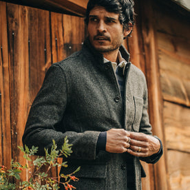 fit model wearing The Gibson Jacket in Charcoal Birdseye Wool, looking left