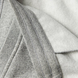 material shot of inside reinforecd waistband with inside fleece constrasted with knit exterior of The Heavy Bag Pant in Heather Grey Fleece