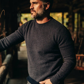 our fit model wearing The Lodge Sweater in Navy—looking left
