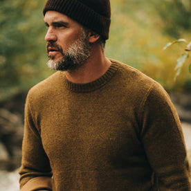 our fit model wearing The Lodge Sweater in Ochre—looking left