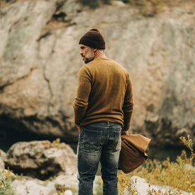 our fit model wearing The Lodge Sweater in Ochre—back toward camera