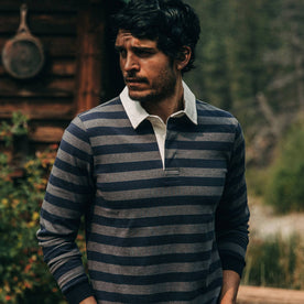fit model wearing The Rugby Shirt in Navy Stripe, hands in pockets