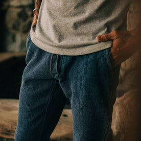 fit model wearing The Après Pant in Indigo Waffle, hands in pockets