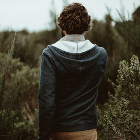 Our fit model wearing The Après Hoodie in Navy from Taylor Stitch.