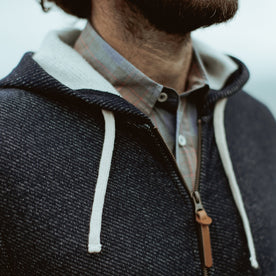 Our fit model wearing The Après Hoodie in Navy from Taylor Stitch.