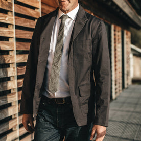 Our fit model in the Gibson jacket in charcoal at a wedding.