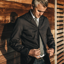 Our fit model in the Gibson jacket in charcoal at a wedding.