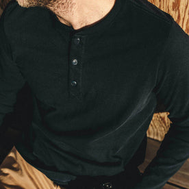 The fit model wearing The Heavy Bag Henley from Taylor Stitch.