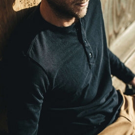 The fit model wearing The Heavy Bag Henley from Taylor Stitch.