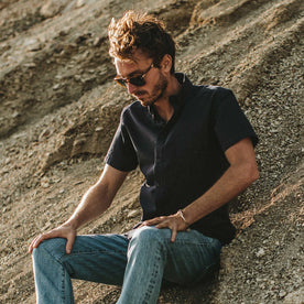 Our fit model on the beach in his Indigo Dobby short sleeve shirt