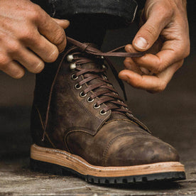 our fit model wearing The Moto Boot in Espresso Grizzly from Taylor Stitch.