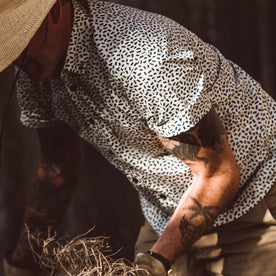 Our fit model wearing The Short Sleeve Jack in Brush Strokes from Taylor Stitch.