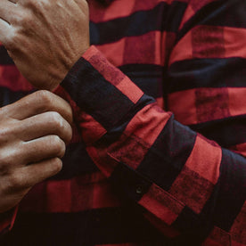 The fit model fixing his cuff of the Yosemite Shirt 
