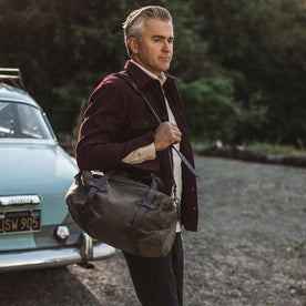 Our fit model wearing The Leeward Shirt while carrying his bag.