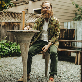 Our fit model wearing The Camp Pant in Dark Olive Tuff Duck from Taylor Stitch.