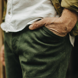 Our fit model wearing The Camp Pant in Dark Olive Tuff Duck from Taylor Stitch.
