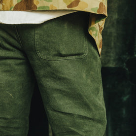 Our fit model wearing The Camp Pant in Dark Olive Tuff Duck from Taylor Stitch.