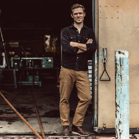 Our fit model wearing The Chore Pant in British Khaki Tuff Duck from Taylor Stitch.