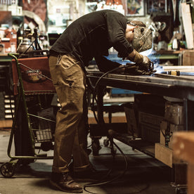 Our fit model wearing The Chore Pant in British Khaki Tuff Duck from Taylor Stitch.