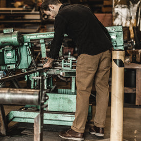 Our fit model wearing The Chore Pant in British Khaki Tuff Duck from Taylor Stitch.