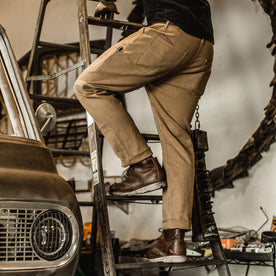 Our fit model wearing The Chore Pant in British Khaki Tuff Duck from Taylor Stitch.