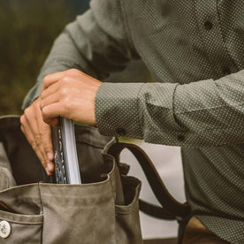Our fit model putting stuff away in his bag.